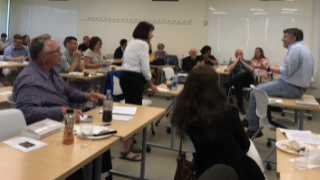 2022 Faculty Seminar News Story (1) 2022 Summer Seminar with faculty and administrators sitting together in a classroom.