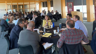 320x180 wrkshp a photo of a group of people sitting and working together
