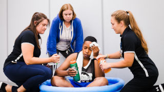 AthleticTrainingStory2x320 Trainers assessing athlete