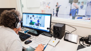 AthleticTrainingStory3x320 Student examining other athletic trainers