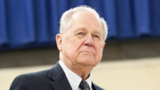 Jim McGlone_320 Photo of Jim McGlone, a pale man who is about 70 years old, has white hair, and is wearing a navy suit.