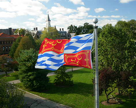 Image of the Seton Hall flag waving in the breeze.