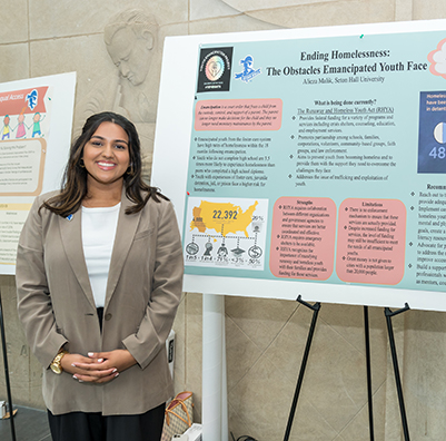 Social work student presenting at a conference.