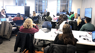 A photo of faculty learning about the DataLab A photo of faculty learning about the DataLab