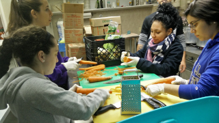 dove-1 A photo of students volunteering at a foodbank.