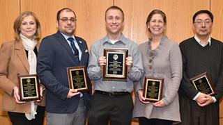 Researcher of the Year Recepients Four faculty members who won Researcher of the Year with their awards.