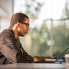 Grad Student Working on a Laptop Grad Student Working on a Laptop