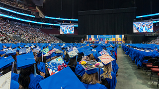 A photo of graduates in their seats at the Prudential Center.