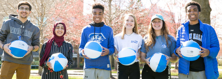 group-of-students-on-campus A photo of a group of students holding beach balls