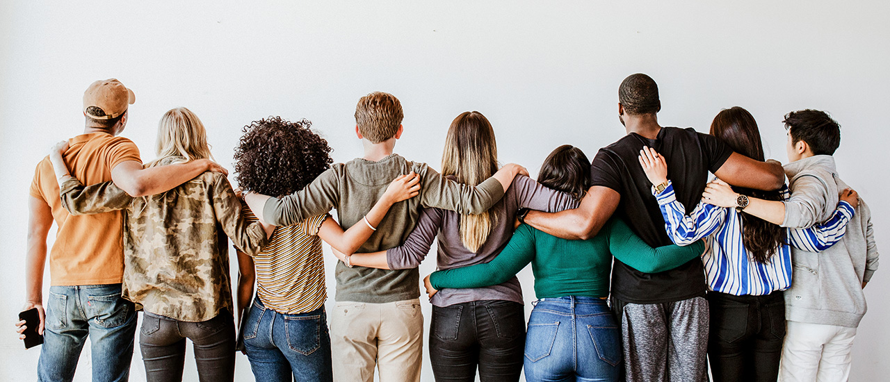 Ethical is Ewuitable People standing together in a row facing away from us.