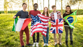 students holding different country flags