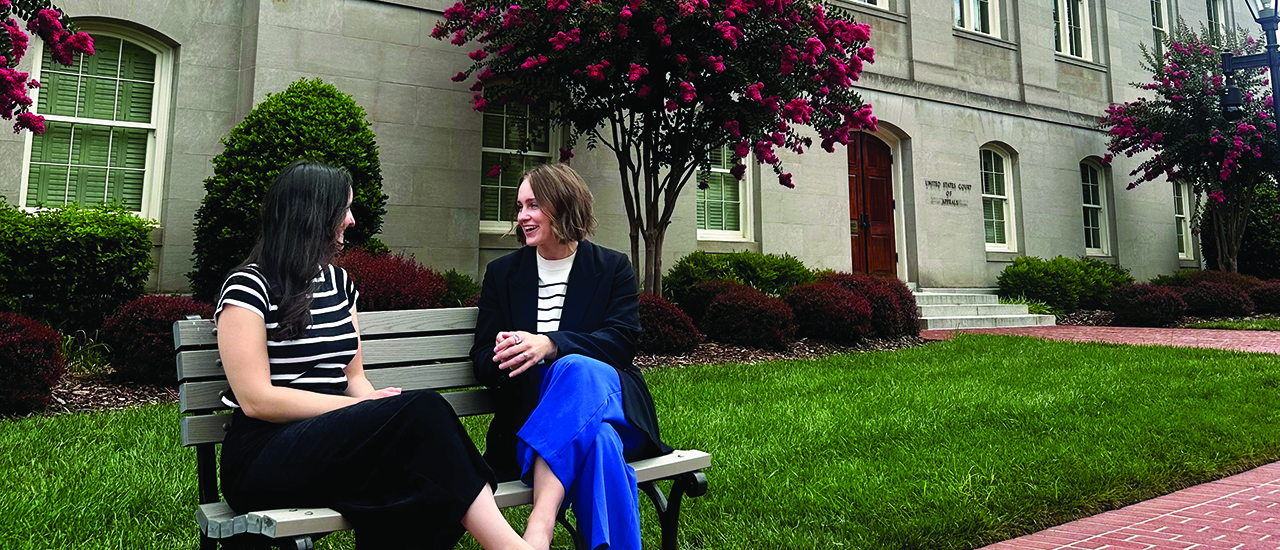 Kaylyn Sanbower, ‘15 Kaylyn Sanbower, ‘15 talking with a friend on a bench.