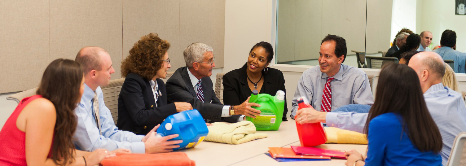 Participants in the Market Research Center observing a product.
