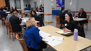 MHA students performing simulation interviews.