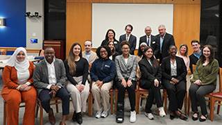MHA students with faculty at the event.