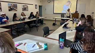 MPA students in a meeting regarding the food drive.