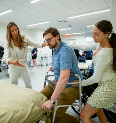 An image of an SHU occupational therapy student working with a patient and their supervisor