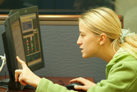 Financial Aid Information Student pointing at computer screen