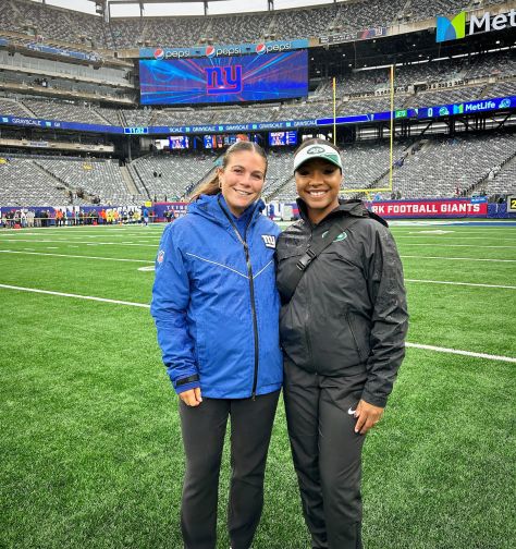A photo of two former SHU AT students at MetLife Stadium