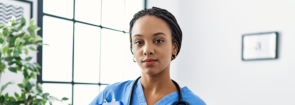 retaining healthcare talent 940x335 A photo of a healthcare professional looking at the camera