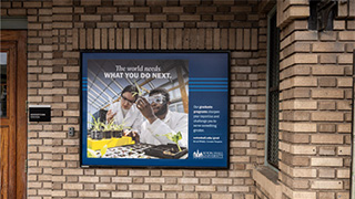 A photo of the add on a brick wall.