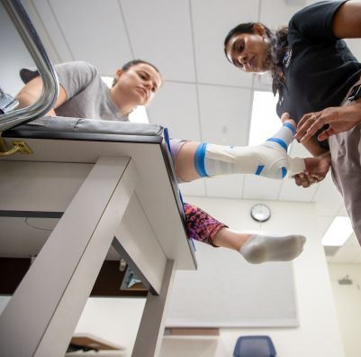 SHU athletic training student works with patient