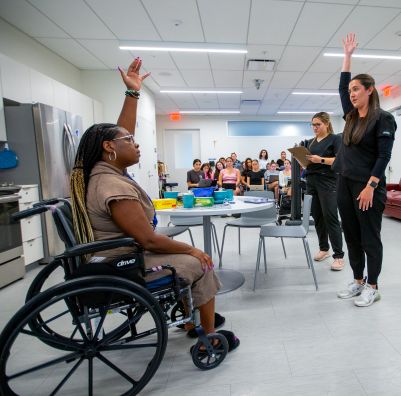 SHU occupational therapy student exercises with patient