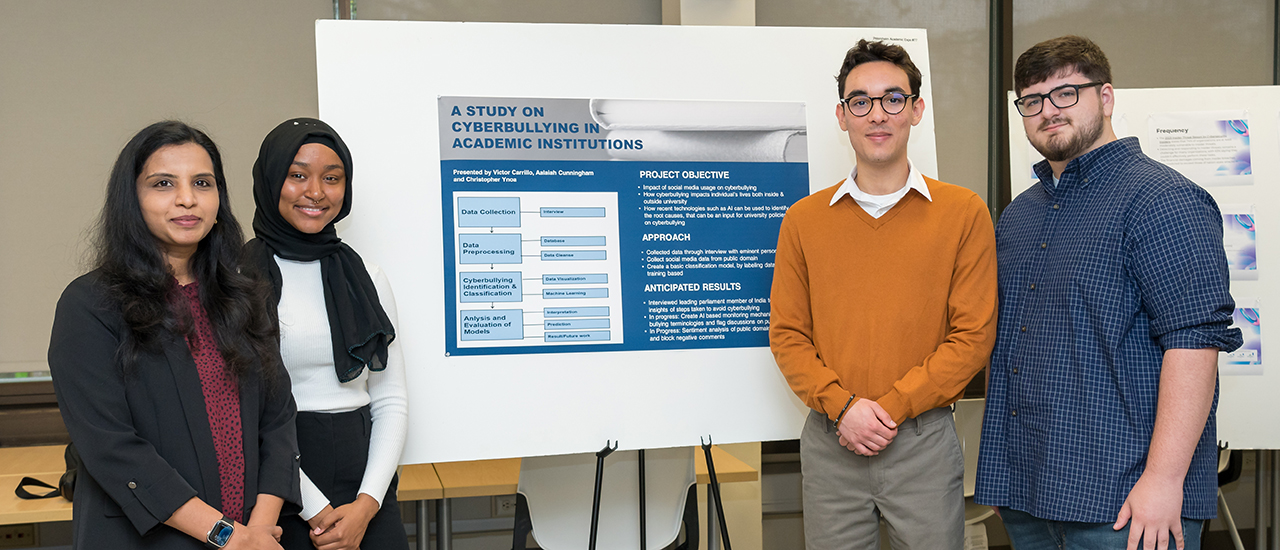 Poster Presentation Students presenting their research at a poster session.