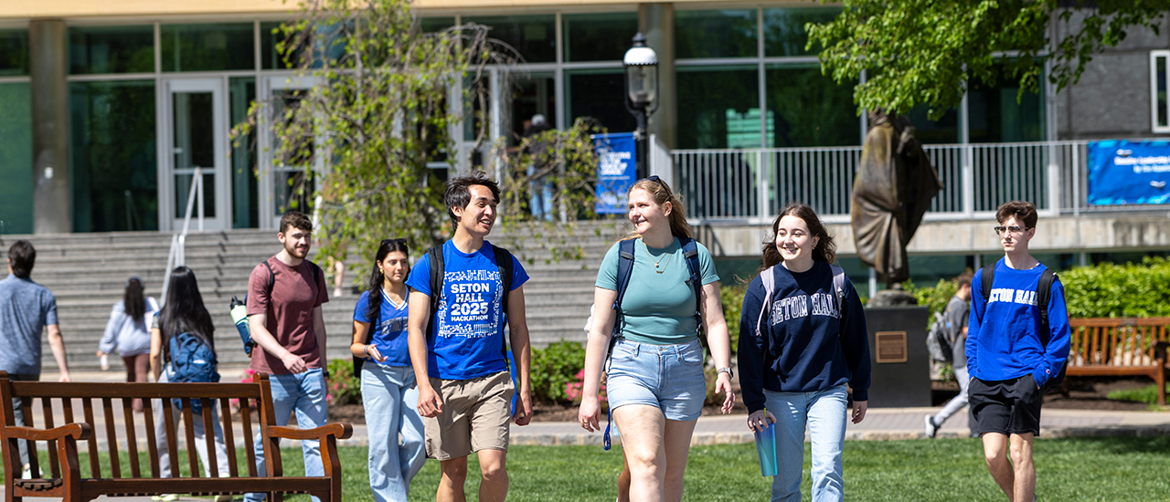 Students walking across campus near Jubilee Hall. Students walking across campus near Jubilee Hall.