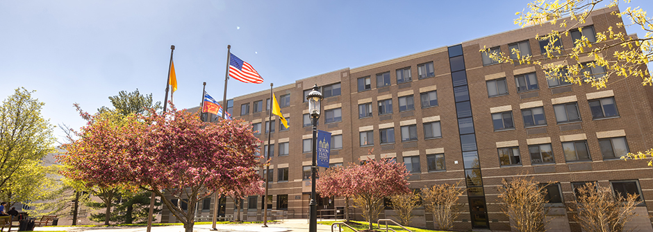 The Complex Exterior The Complex Exterior with Flag Poles Outside
